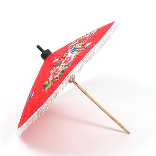 Red parasol with floral design on a white background