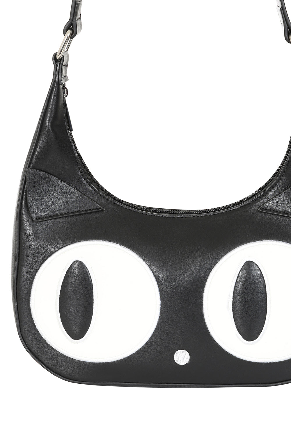 Black handbag with large white eyes on a white background