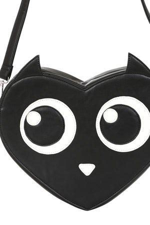 Black heart-shaped bag with cat face design on a white background