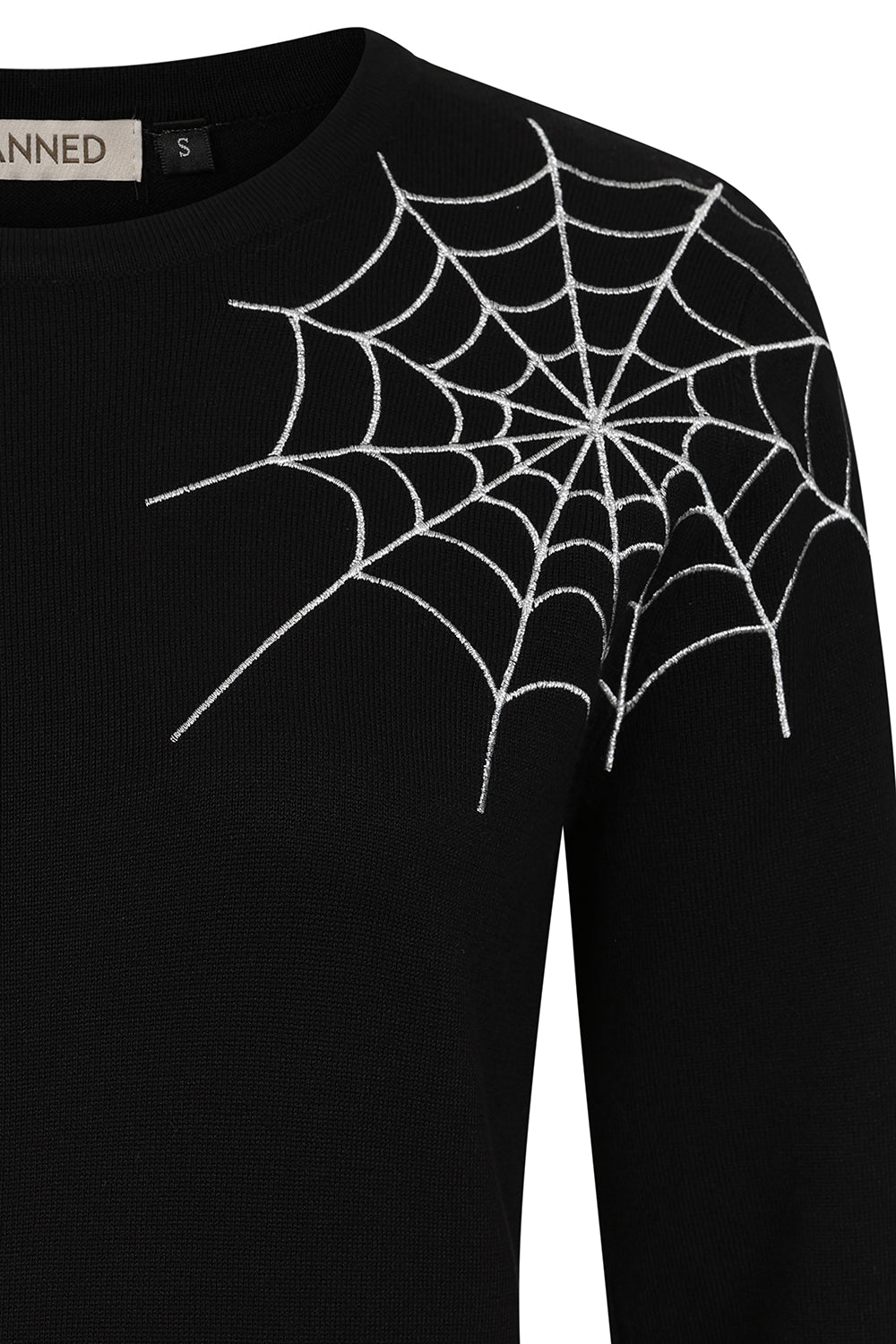 Black sweater with spider web design on a white background