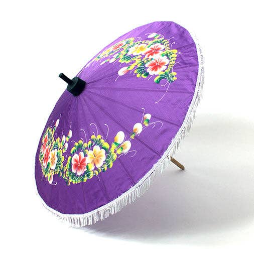 Purple umbrella with floral design on a white background
