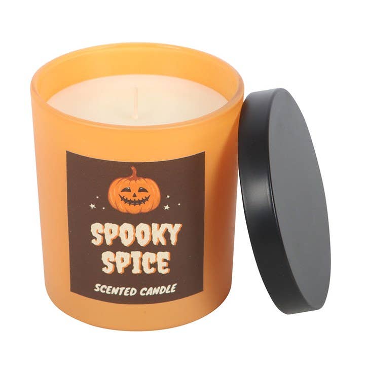 Spooky Spice scented candle with an orange container and black lid on a white background