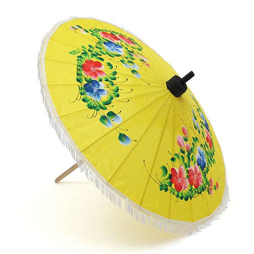 Yellow umbrella with floral design on a white background