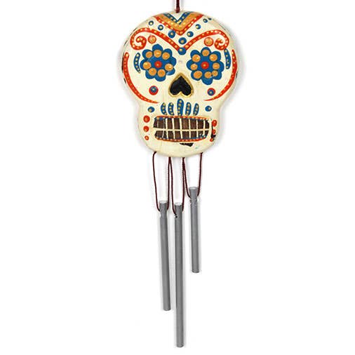 Decorative wind chime with a colorful skull design on a white background