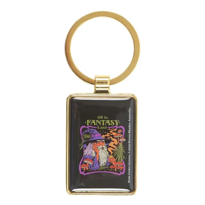 Keychain with a colorful design of a wizard and text 'Off to Fantasy Land' on a black background.