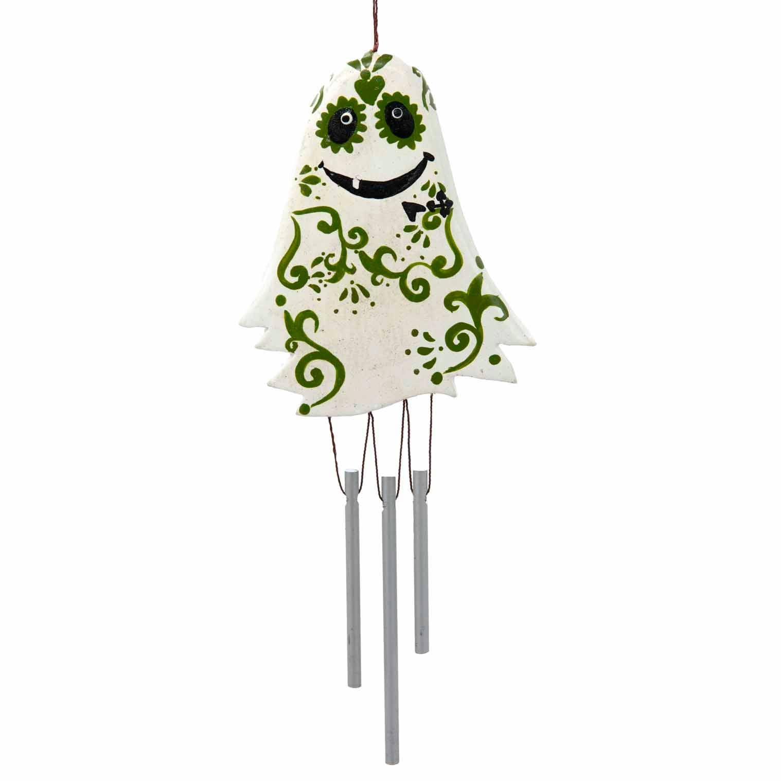 Decorative ghost wind chime with green patterns on a white background