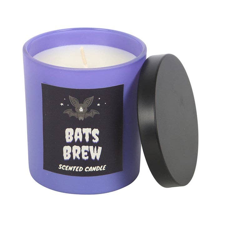 Scented candle labeled 'Bats Brew' with a purple container and black lid on a white background