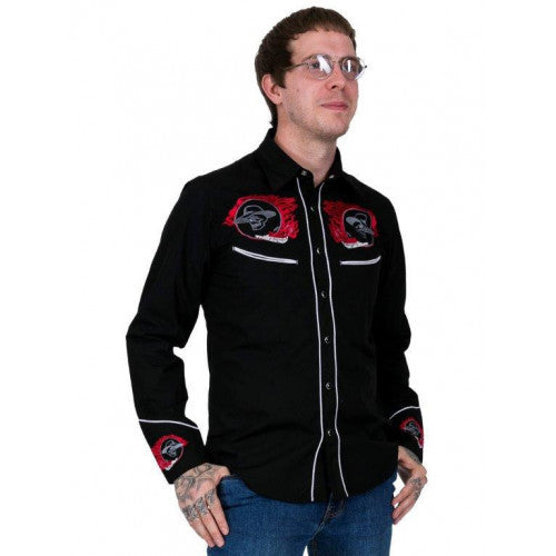 Man wearing a black embroidered shirt with red designs on a white background