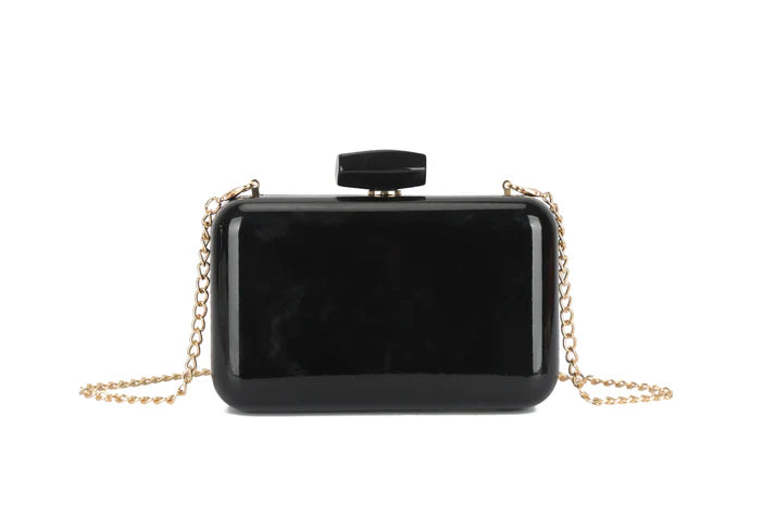 Black rectangular clutch bag with a gold chain on a white background