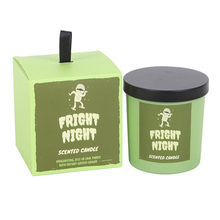 Green 'Fright Night' scented candle with black lid and matching green box on a white background
