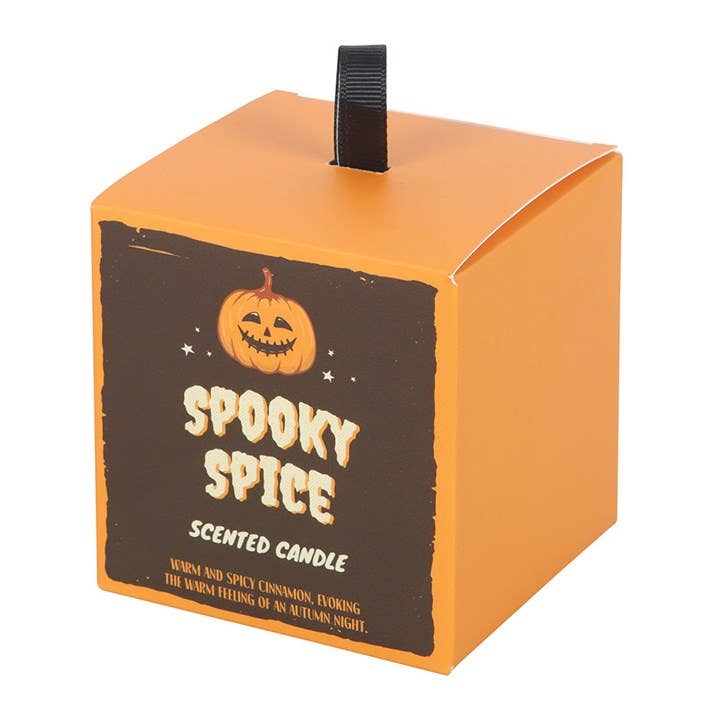 Halloween-themed scented candle packaging with a pumpkin design on an orange box.
