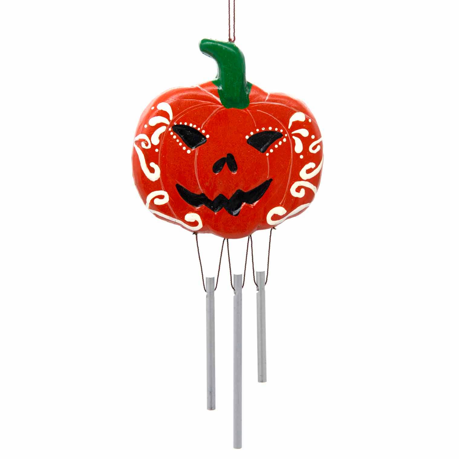 Pumpkin-shaped wind chime with jack-o'-lantern face on a white background
