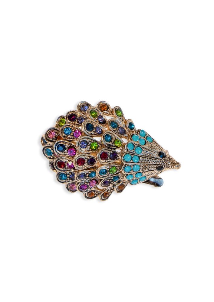 Multicolored gemstone brooch on a white background